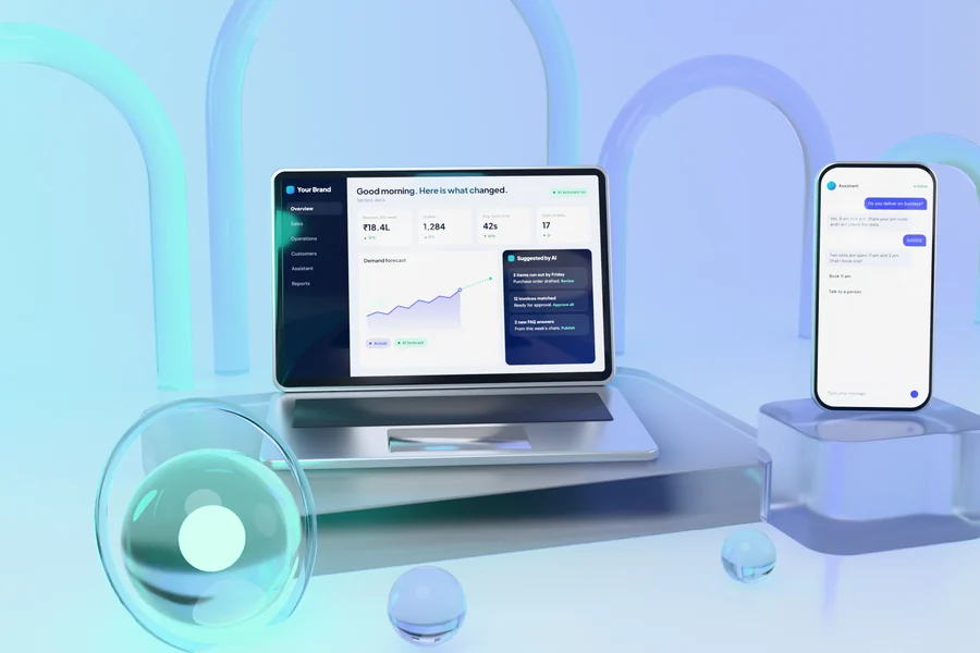 A laptop showing an AI operations dashboard and a phone showing an AI assistant, on glass plinths among glass arches